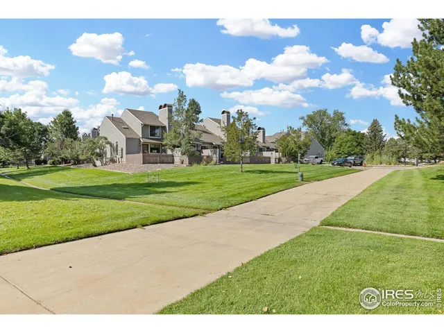 a swimming pool with outdoor seating and yard