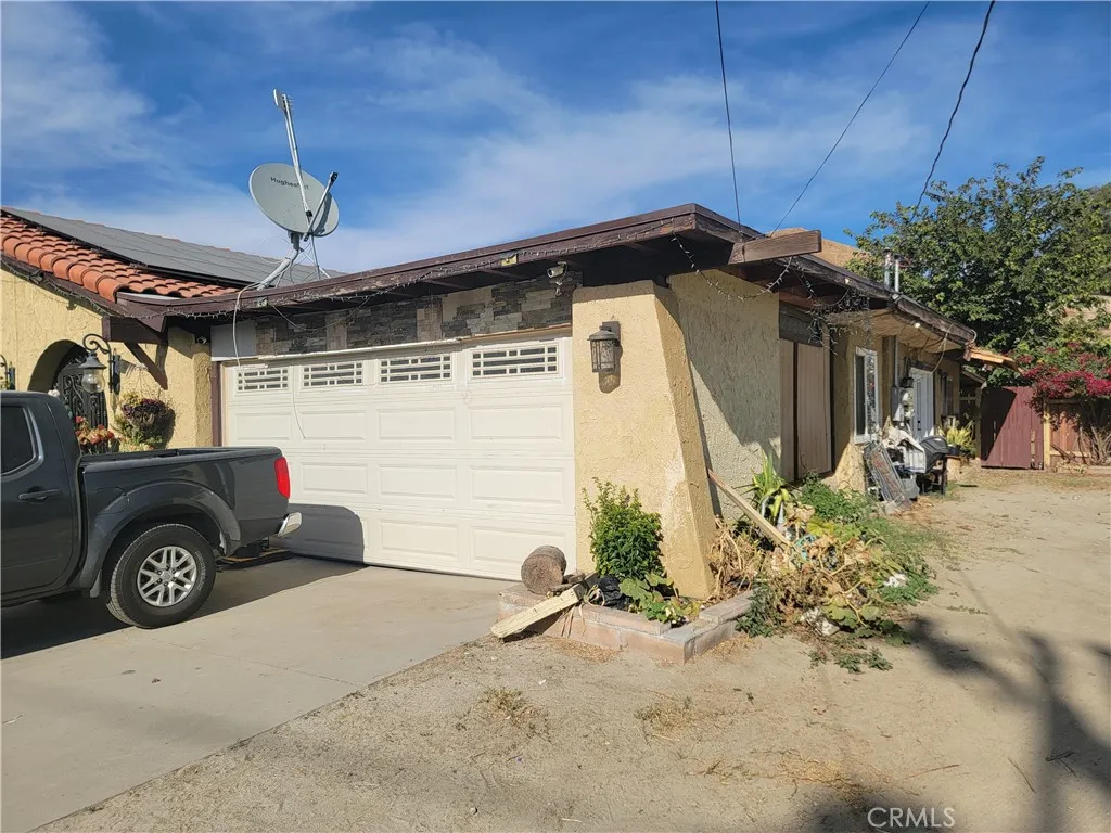 12738 Reche Canyon Road Colton, CA 92324 - Photo 3 of 9 a front view of a house with parking