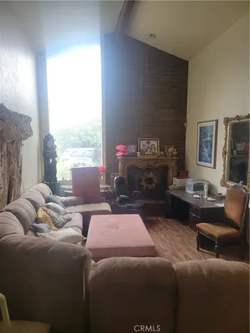 a bedroom with furniture and a fireplace