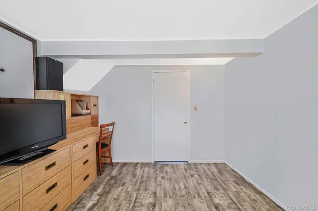 a room with furniture and flat screen tv