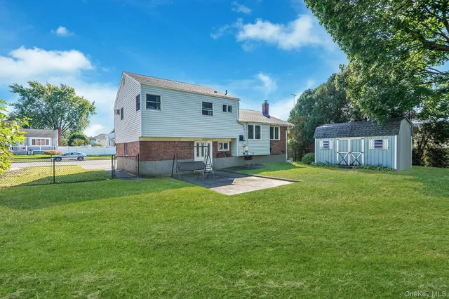 a house view with a sitting space and garden
