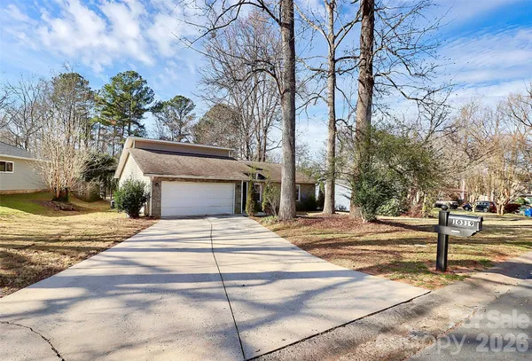 a view of a house with a snow in the yard