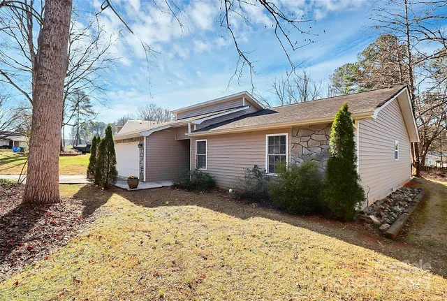 a view of a house with a snow in the yard