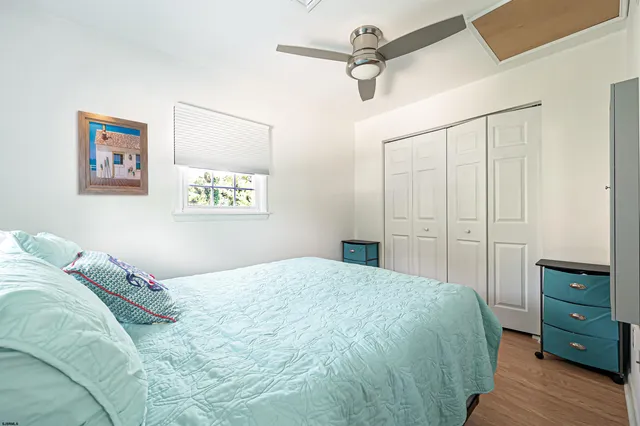 a bedroom with a bed and a dresser