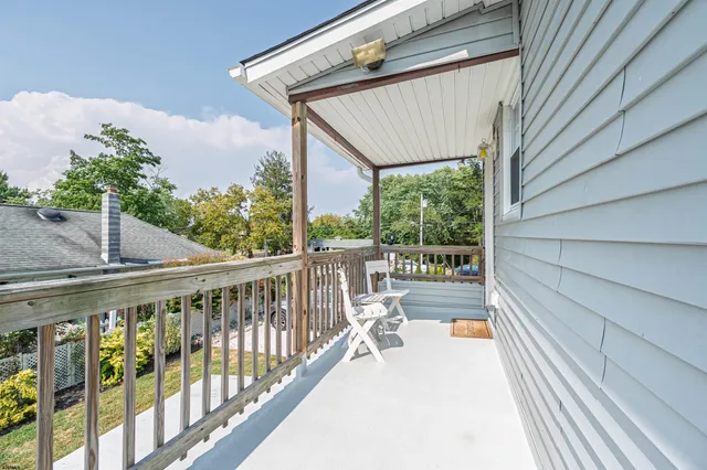 a view of balcony with furniture