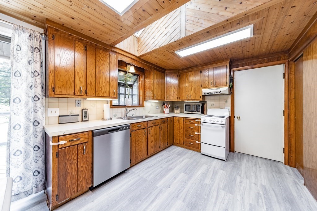 11 Clark Wright Road Middlefield, MA 01011 - Photo 14 of 30 a kitchen with granite countertop wooden floors and white stainless steel appliances