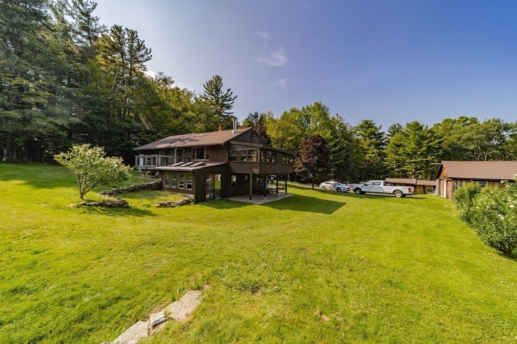 11 Clark Wright Road Middlefield, MA 01011 - Photo 2 of 30 a swimming pool with outdoor seating and yard