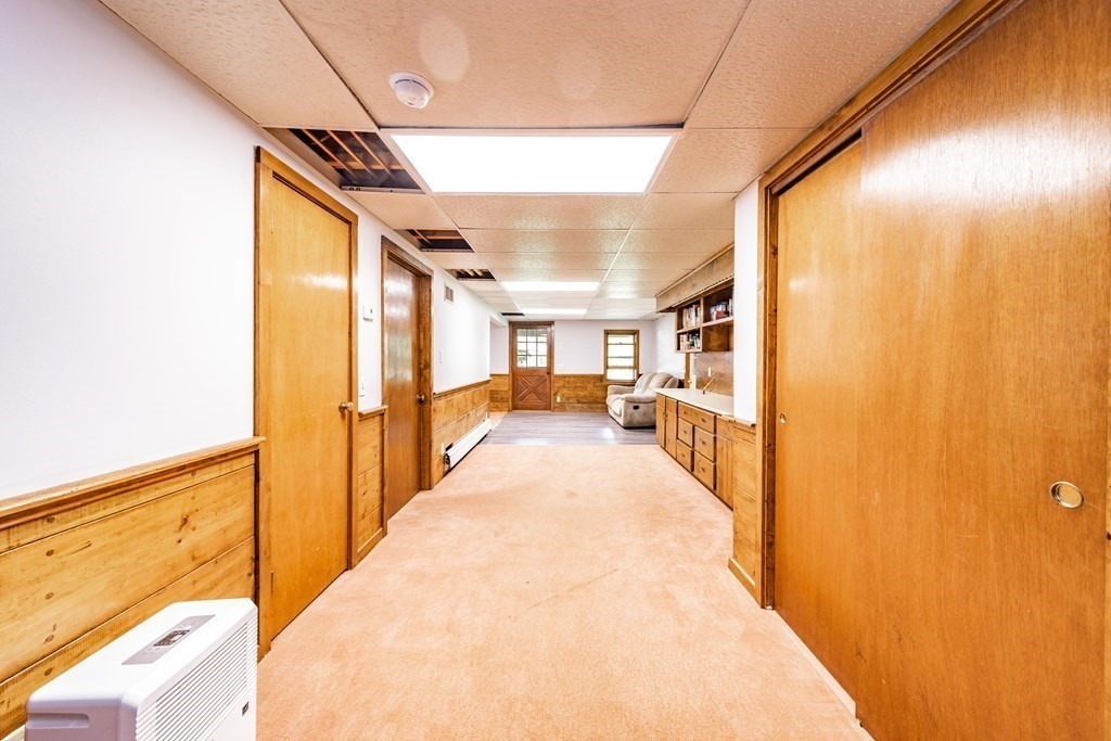 11 Clark Wright Road Middlefield, MA 01011 - Photo 25 of 30 a view of a hallway with wooden floor and staircase