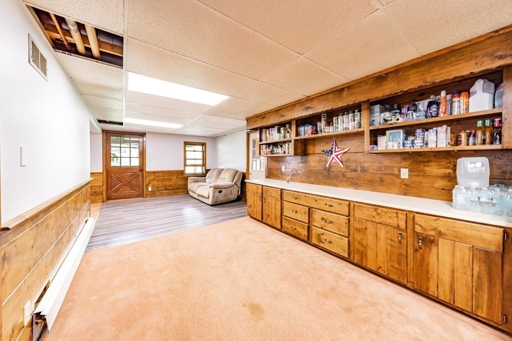 11 Clark Wright Road Middlefield, MA 01011 - Photo 26 of 30 a living room with stainless steel appliances lots of white furniture stove top oven and cabinets