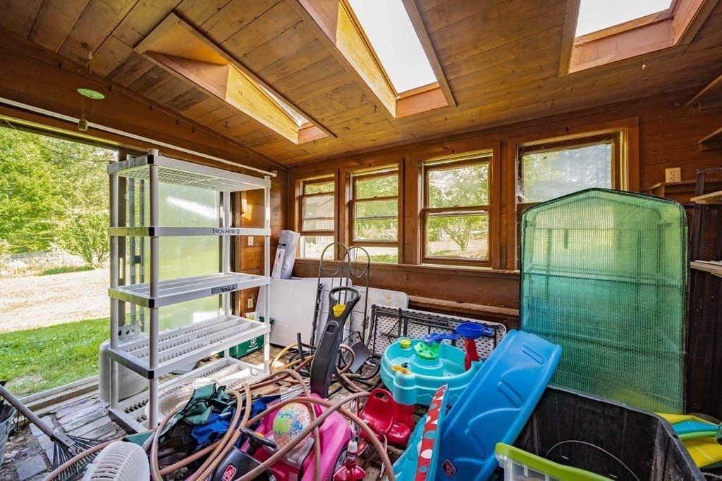 11 Clark Wright Road Middlefield, MA 01011 - Photo 30 of 30 a living room filled with furniture and a floor to ceiling window