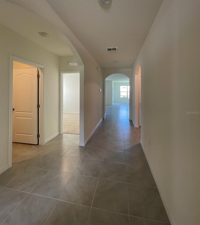 1779 Buckeye Road Davenport, FL 33837 - Photo 4 of 20 a view of a hallway