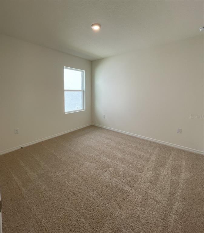 1779 Buckeye Road Davenport, FL 33837 - Photo 10 of 20 an empty room with a window