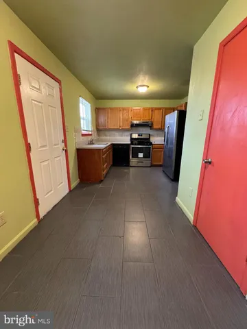 a view of kitchen with furniture and window