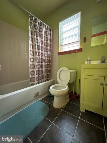 a bathroom with a toilet and a sink