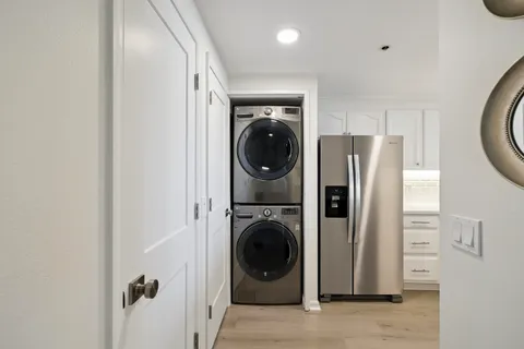 a view of a hallway with washer and dryer