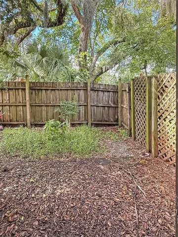 a garden with wooden fence