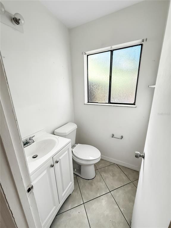 322 Canal Road, Unit G41 Edgewater, FL 32132 - Photo 6 of 14 a bathroom with a toilet sink and mirror