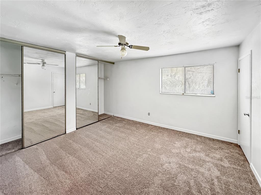 322 Canal Road, Unit G41 Edgewater, FL 32132 - Photo 9 of 14 an empty room with windows and fan