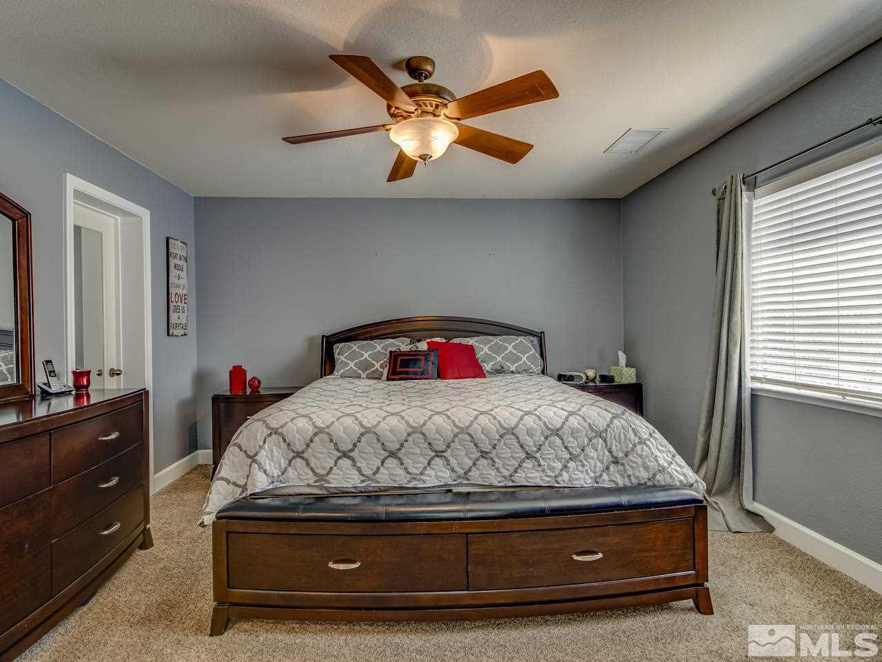 1990 Black Sand Drive Reno, NV 89521 - Photo 11 of 25 a bedroom with a bed and a window