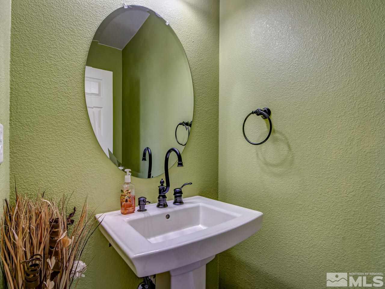 1990 Black Sand Drive Reno, NV 89521 - Photo 20 of 25 a bathroom with a sink and a mirror