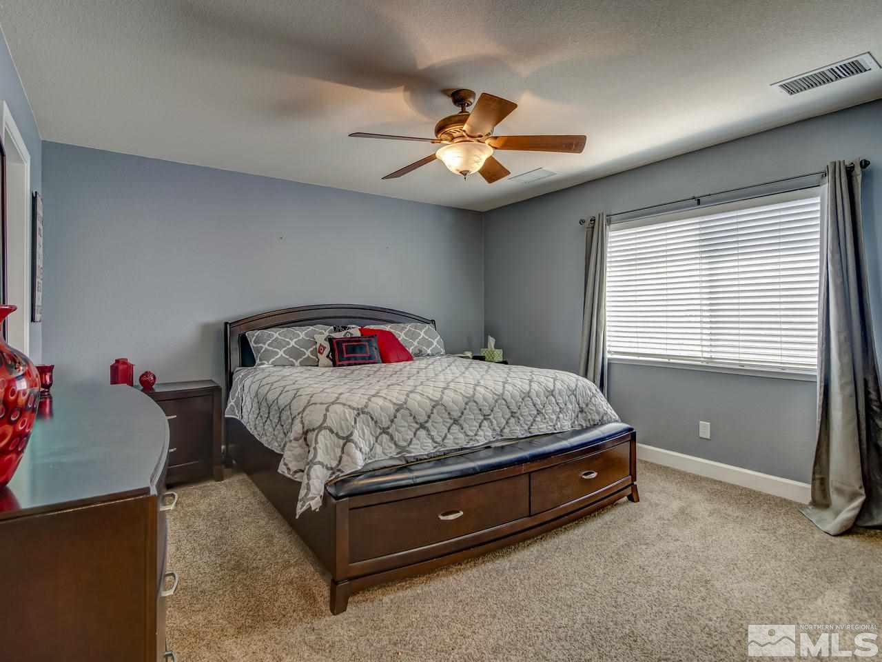1990 Black Sand Drive Reno, NV 89521 - Photo 10 of 25 a bed sitting in a bedroom next to a window
