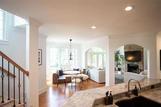 a living room with furniture window and wooden floor