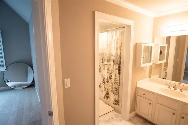 wooden floor fireplace and windows in an empty room