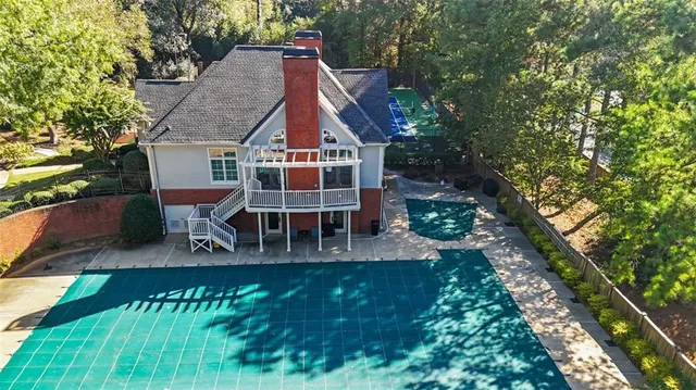 an aerial view of house with a yard
