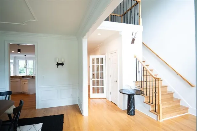a view of a hallway with furniture and entryway