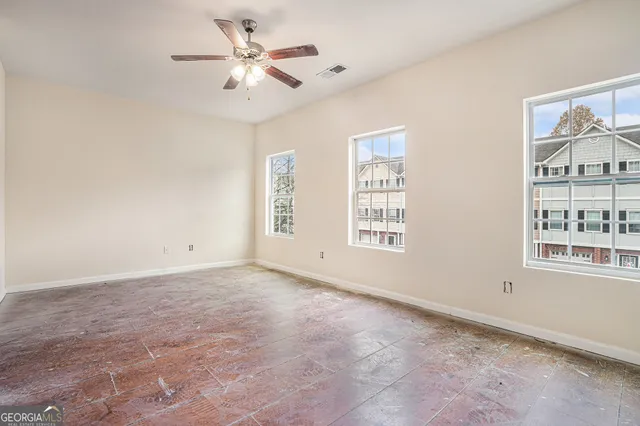 a view of an empty room with a window
