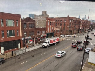 1215 West Grand Avenue, Unit 3F Chicago, IL 60642 - Photo 15 of 15 a car parked in the middle of a building