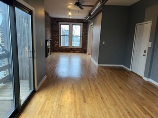 1215 West Grand Avenue, Unit 3F Chicago, IL 60642 - Photo 4 of 15 a view of gallery with wooden floor