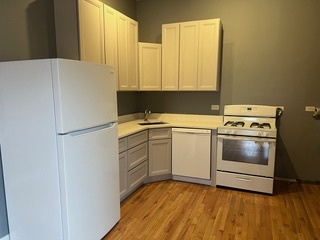 1215 West Grand Avenue, Unit 3F Chicago, IL 60642 - Photo 8 of 15 a utility room with washer and dryer