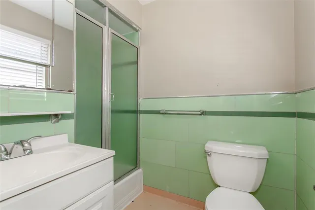 a bathroom with a toilet and a sink