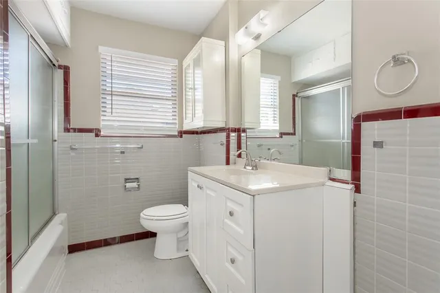 a view of bathroom with a sink toilet and a mirror