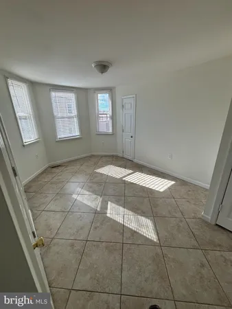 a view of an empty room with windows