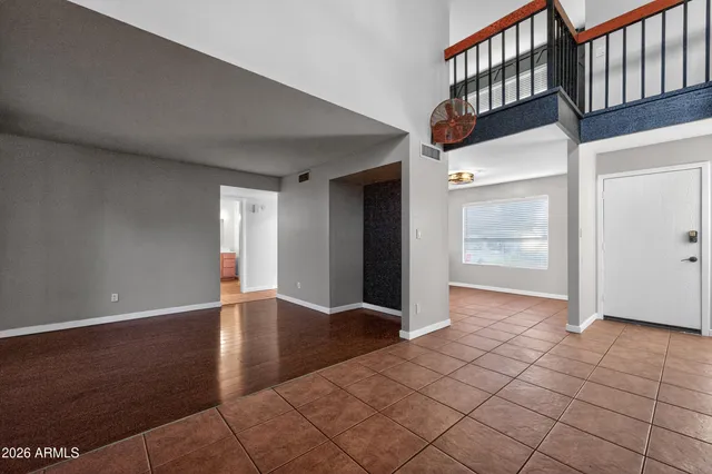 a view of an entryway with wooden floor