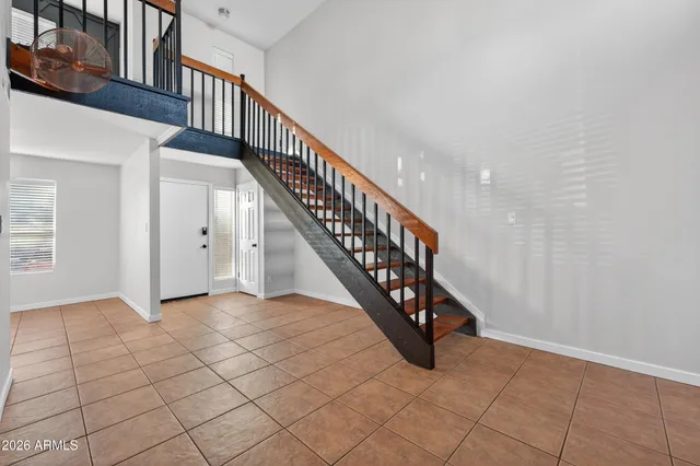 a room with a bed and a window