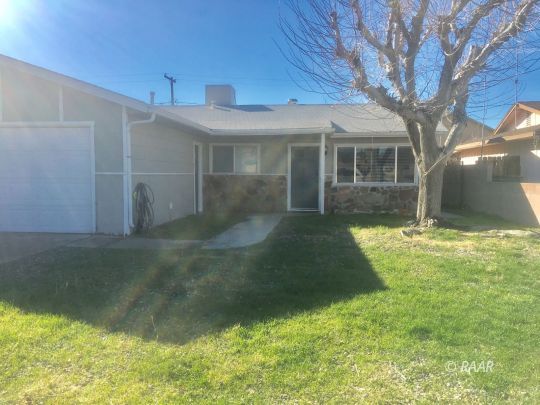 209 South American Street Ridgecrest, CA 93555 - Photo 16 of 16 a front view of a house with a yard