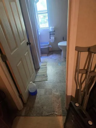 a bathroom with a sink and toilet