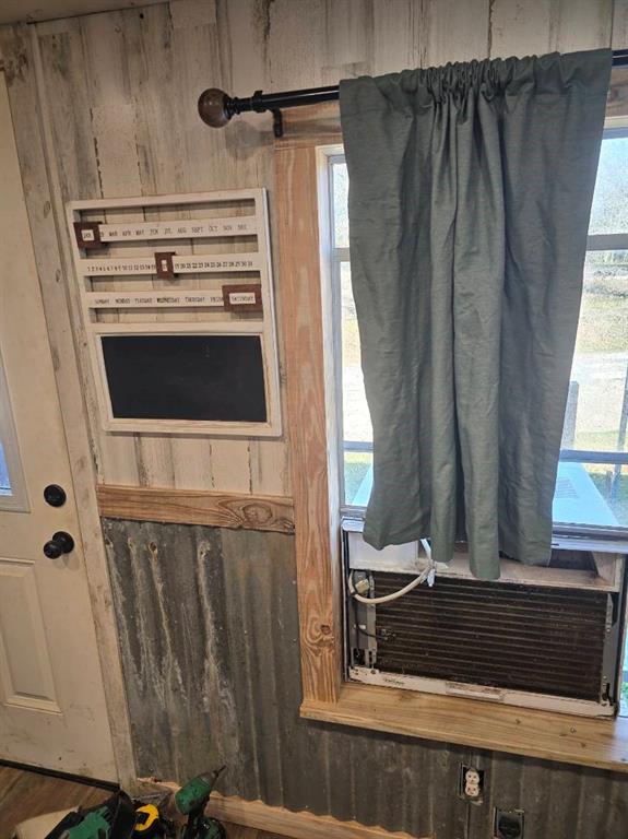 390 Campground Road Trinity, TX 75862 - Photo 25 of 37 Shiplap wall paneling paired with corrugated metal wainscoting
