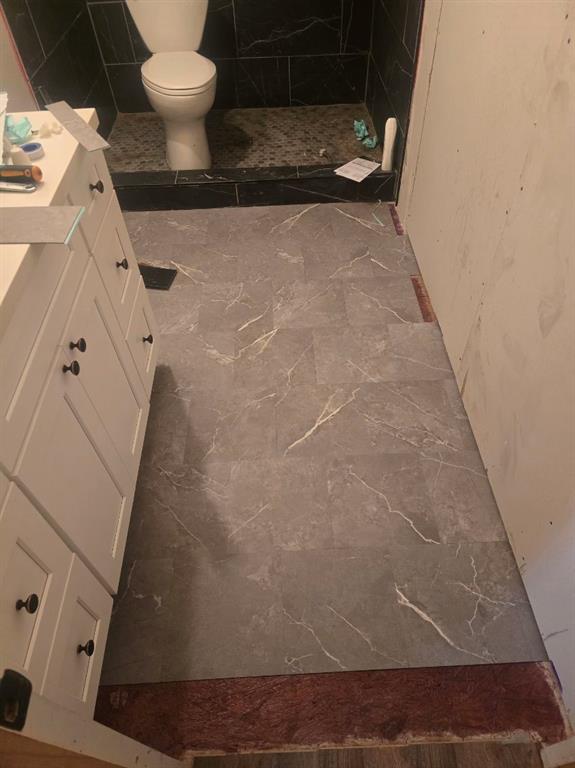 390 Campground Road Trinity, TX 75862 - Photo 26 of 37 Grey wood-finish flooring with white veining