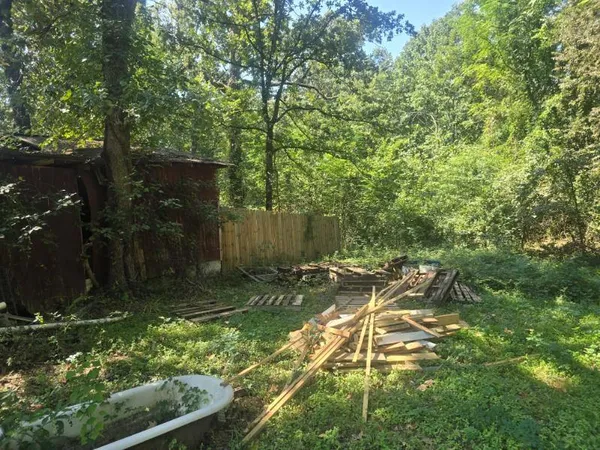 a view of swimming pool with a yard