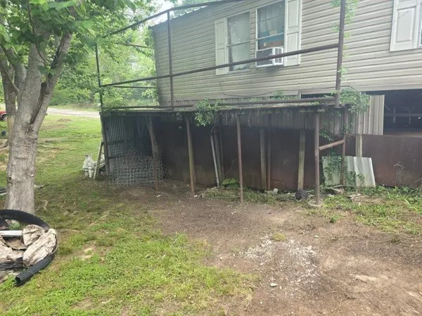 a view of a backyard with table and chairs