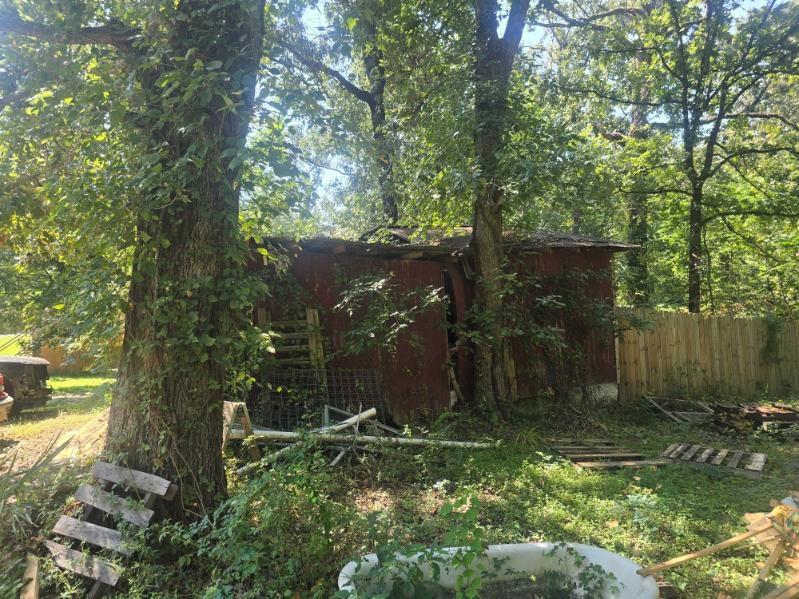 390 Campground Road Trinity, TX 75862 - Photo 7 of 37 Fenced property featuring mature trees and a rustic outbuilding