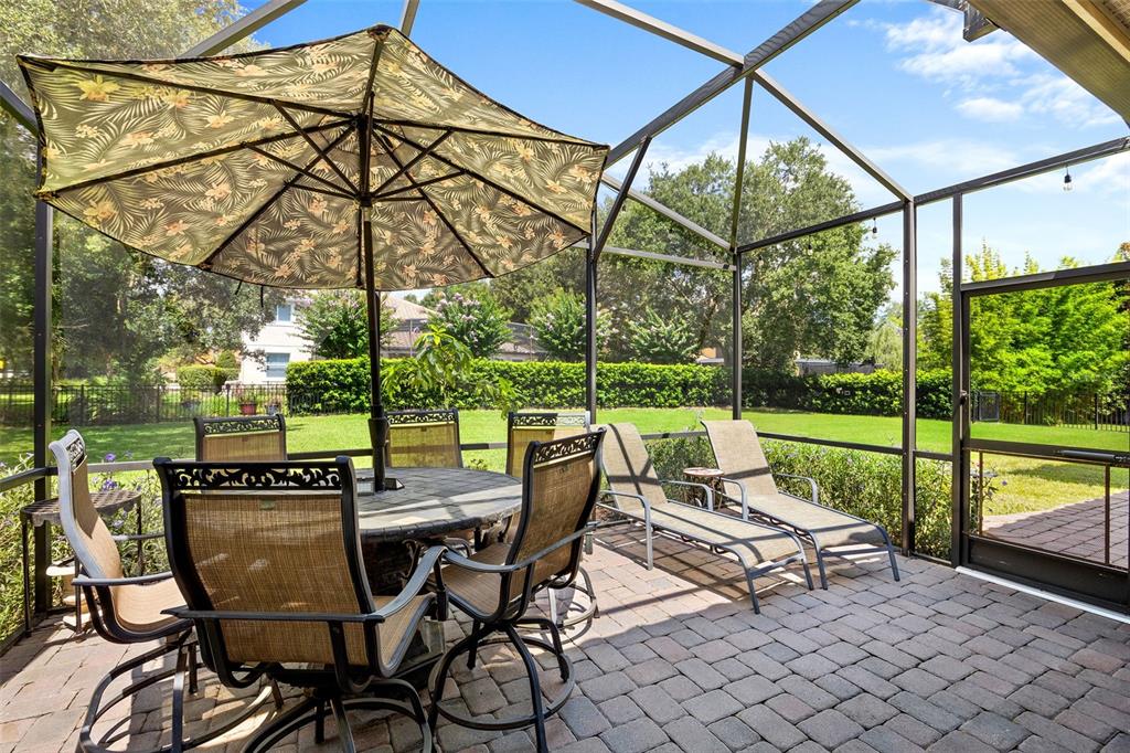 8692 Crested Eagle Place Sanford, FL 32771 - Photo 19 of 56 a view of an chairs and table in the patio