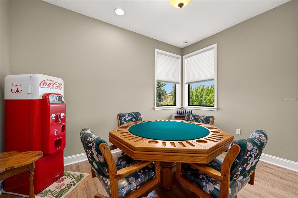 8692 Crested Eagle Place Sanford, FL 32771 - Photo 24 of 56 a dining room with furniture and window