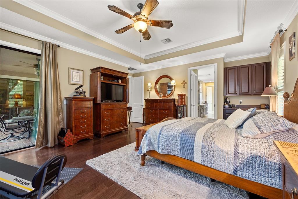 8692 Crested Eagle Place Sanford, FL 32771 - Photo 26 of 56 a bed room with a bed window and a dresser