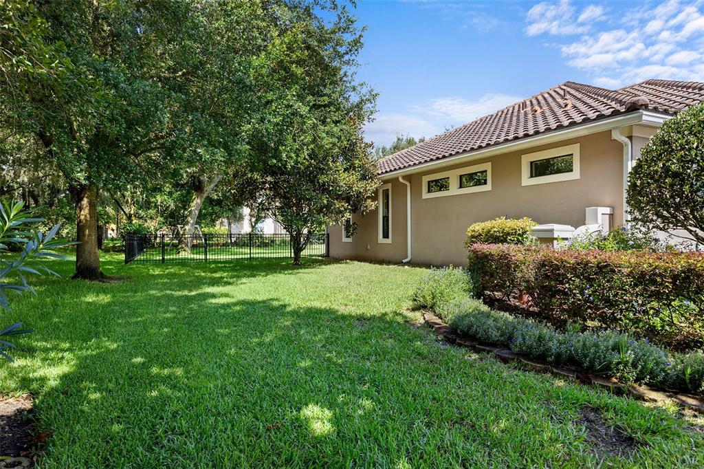 8692 Crested Eagle Place Sanford, FL 32771 - Photo 4 of 56 a front view of house with yard and green space