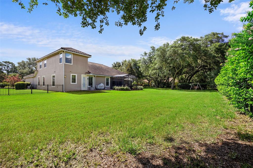 8692 Crested Eagle Place Sanford, FL 32771 - Photo 41 of 56 a front view of a house with garden